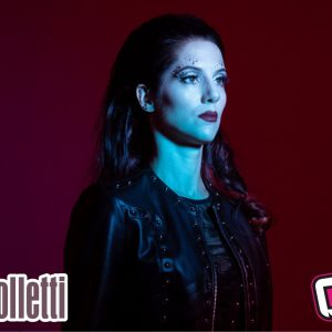 L'ospite della puntata di venerdì 26 novembre di "Riflettore" è Alessia Scolletti, in arte Melany,la voce femminile dei Temperance, uno dei gruppi più importanti e interessanti del panorama metal del nostro paese, conosciuto oltre i confini nazionali. La band ha recentemente pubblicato il sesto album dal titolo "Diamanti" e il video dell'omonimo singolo, in pochi giorni,è stato pubblicato lo scorso 16 novembre, ha quasi raggiunto le 100 mila visulizzazioni Gli altri componeti dei Temperance sono Marco Pastorino, Michele Guaitoli, Luca Negro e Alfonso Mocerino. Alessia Scolletti è inoltre l'unica voce femminile italiana del progetto new age Era, capitanato dal musicista e compositore francese Eric Lévi, che propone un miscuglio di rock, synth e pseudo-latino canto gregoriano.